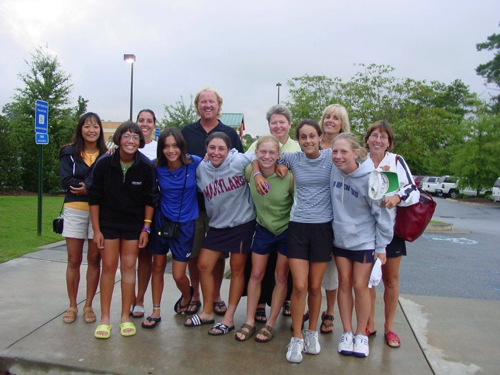 tennis team of girls in red